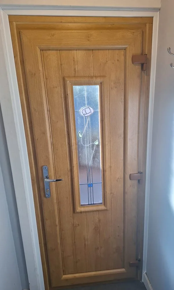 Irish oak uPVC door, fitted by Ultimate Home Solutions