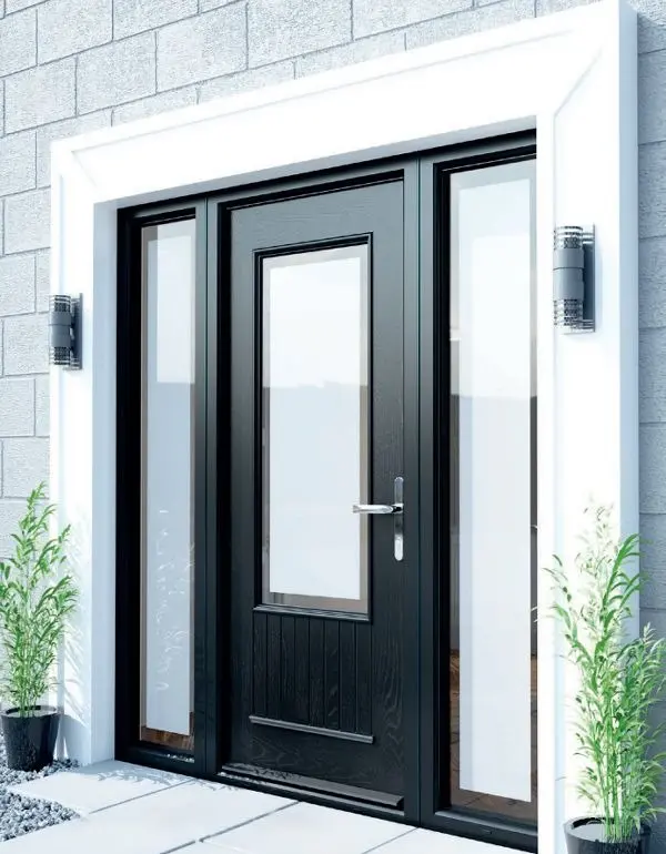 Black composite front door with glazed side panels on a traditional stone frontage