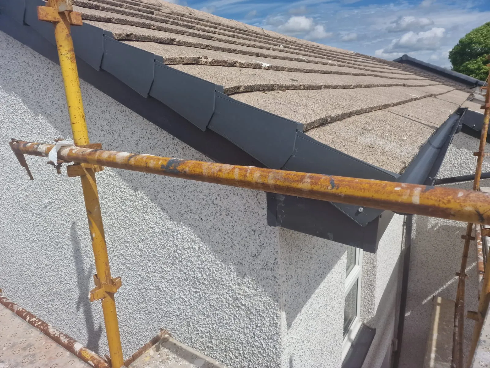 New anthracite-grey fascia, gutter and bargeboard on a gable by Ultimate Home Solutions